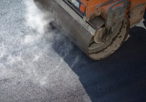 Tractor on hot asphalt